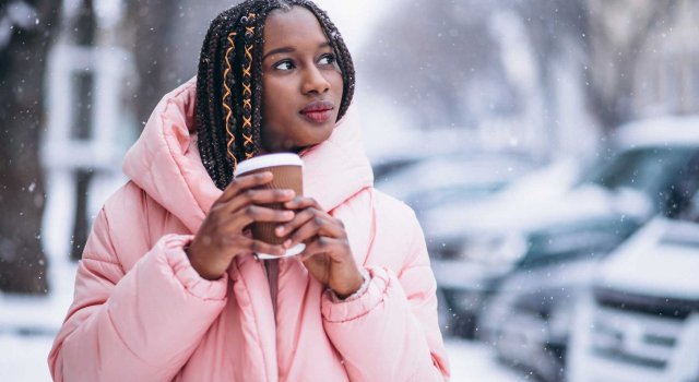 african american drinking coffee winter day