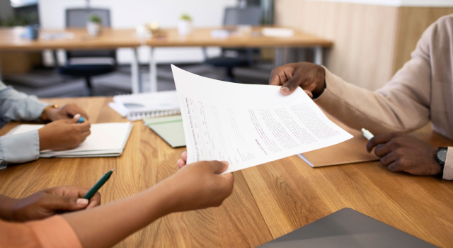 man holding contract his new office job after interview2