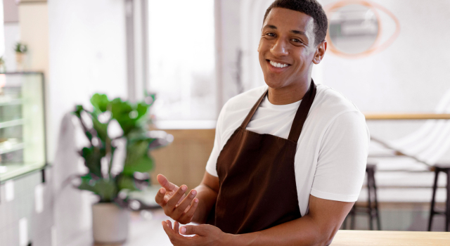 medium shot smiley man with apron