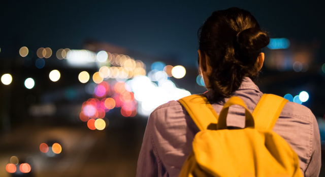 rear view women standing illuminated city night