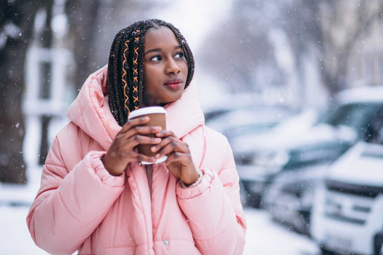 african american drinking coffee winter day