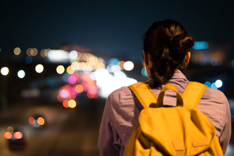 rear view women standing illuminated city night